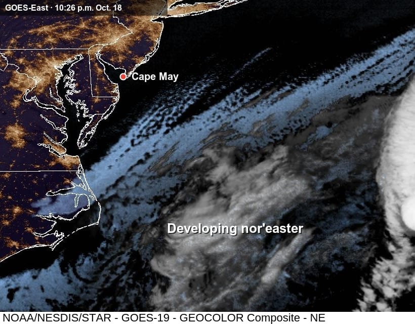 Night satellite image showing the developing nor'easter's cloud shield over the Atlantic southeast of Cape May, with the lights of New Jersey, Delaware, Maryland and Virginia along the coast